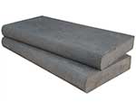 A stack of bluestone swimming pool coping