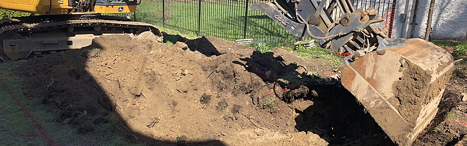 Excavator digging a swimming pool